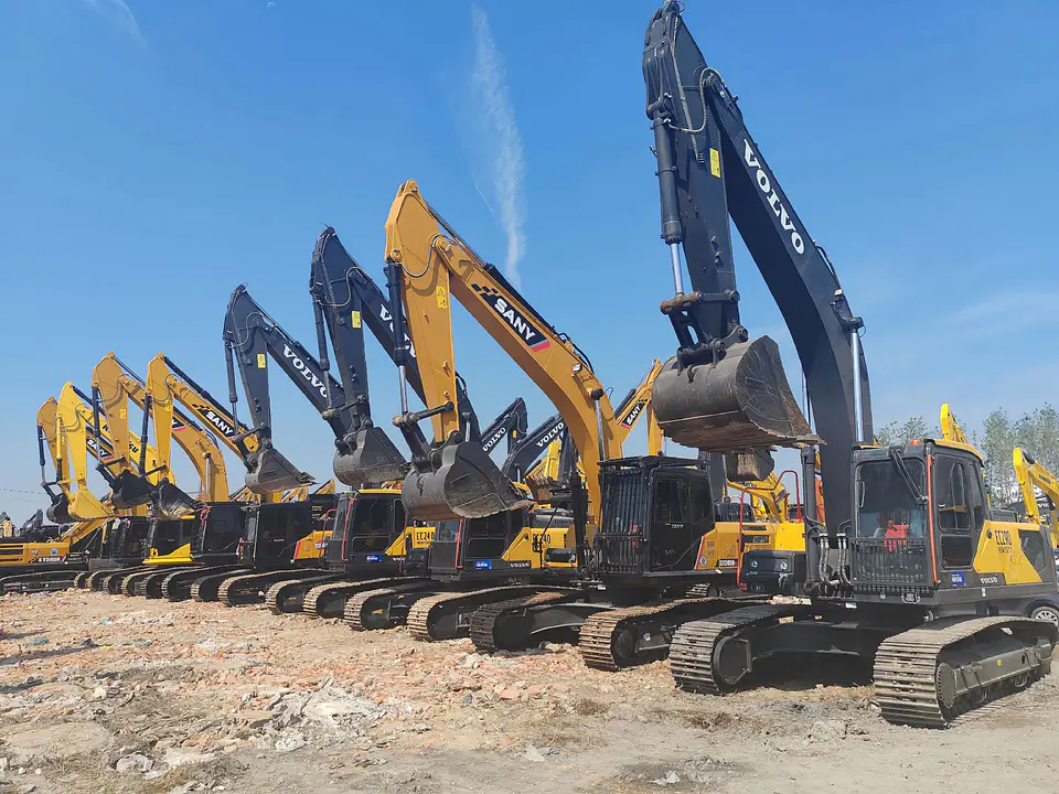 Excavators lined up in a construction equipment supply yard
