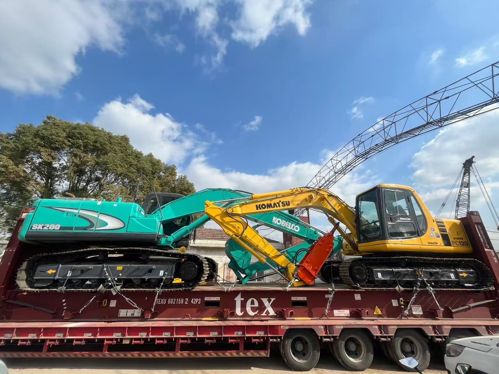 Excavators secured for equipment transport